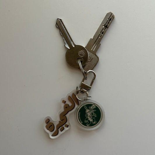 A stylish and durable keychain made of acrylic, perfect for keys, bags, and accessories.