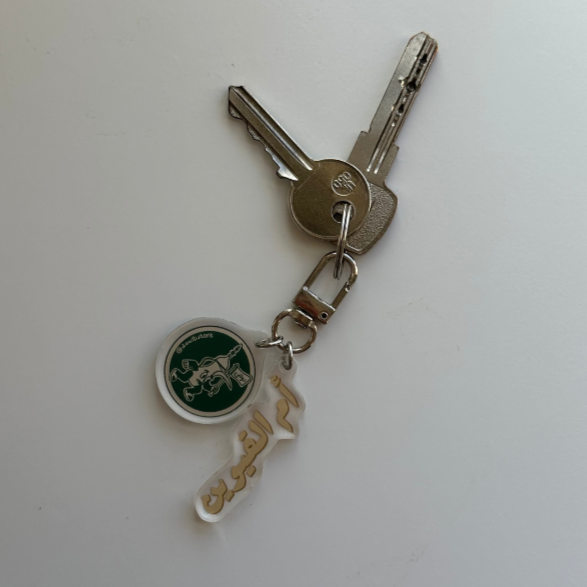 A stylish and durable keychain made of acrylic, perfect for keys, bags, and accessories.