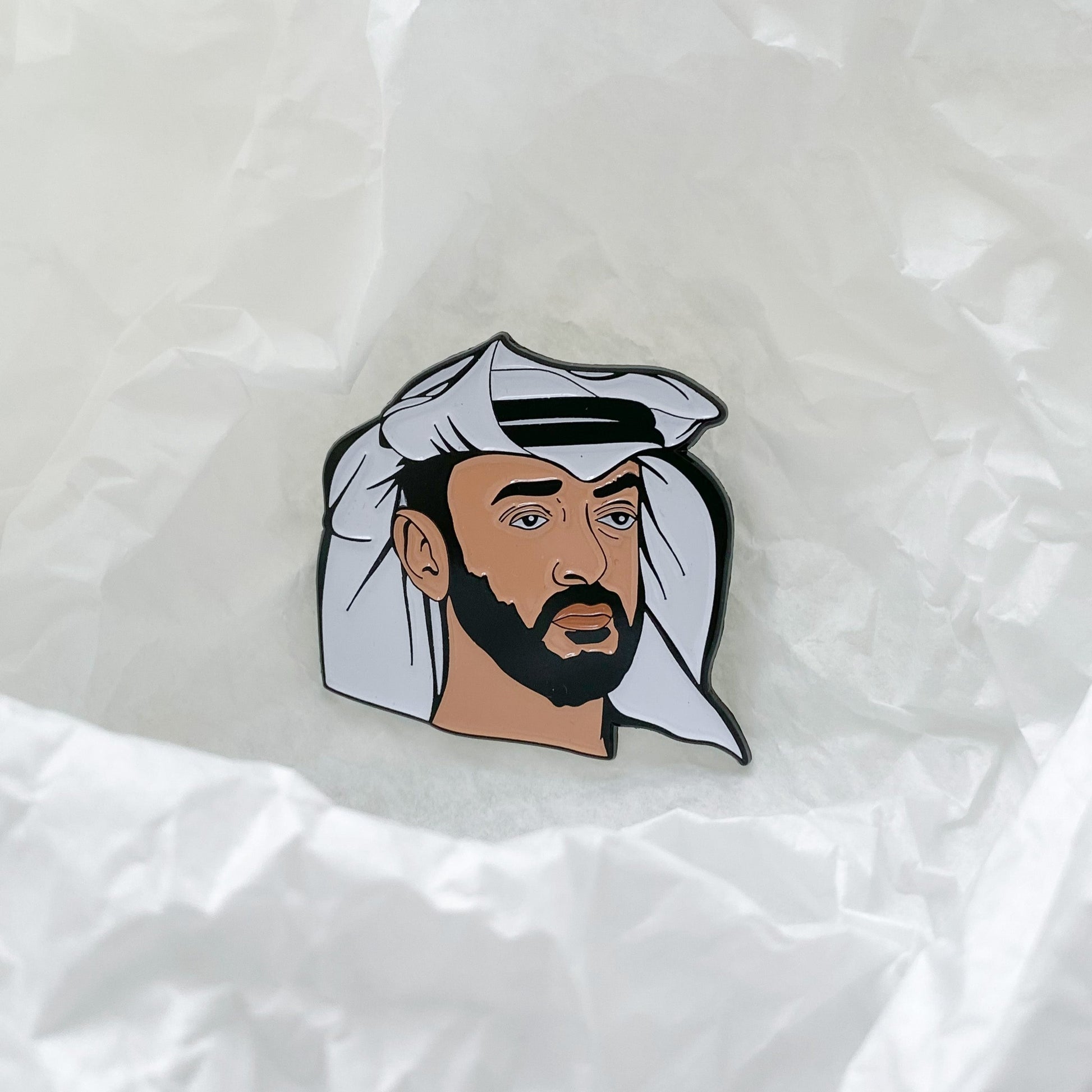 A metal enamel pin featuring a colorful portrait of Sheikh Mohammed bin Zayed Al Nahyan, designed to celebrate his leadership and vision for the UAE.